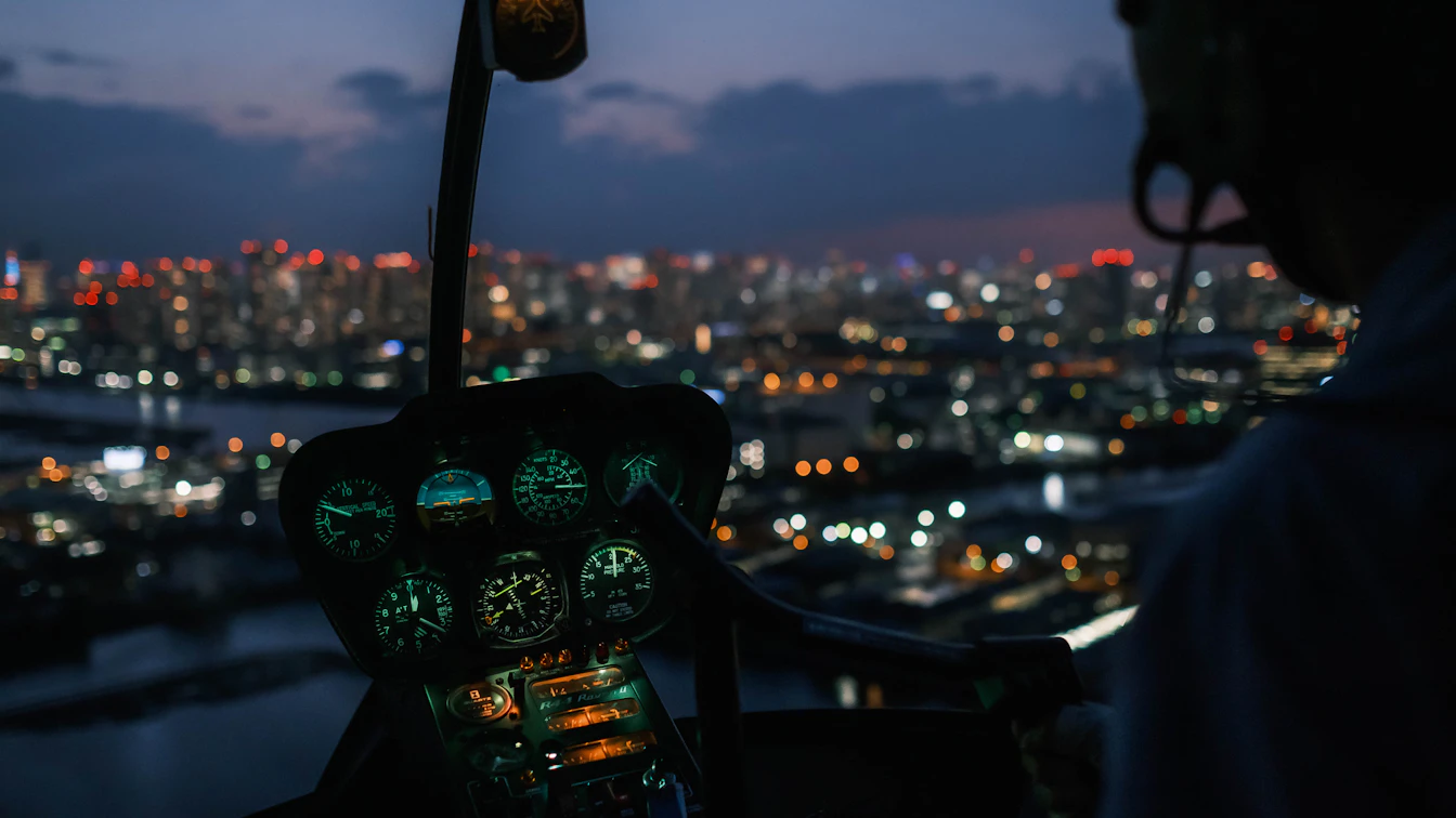 Children in pilot uniforms learning in an airplane cockpit at KidZania Tokyo