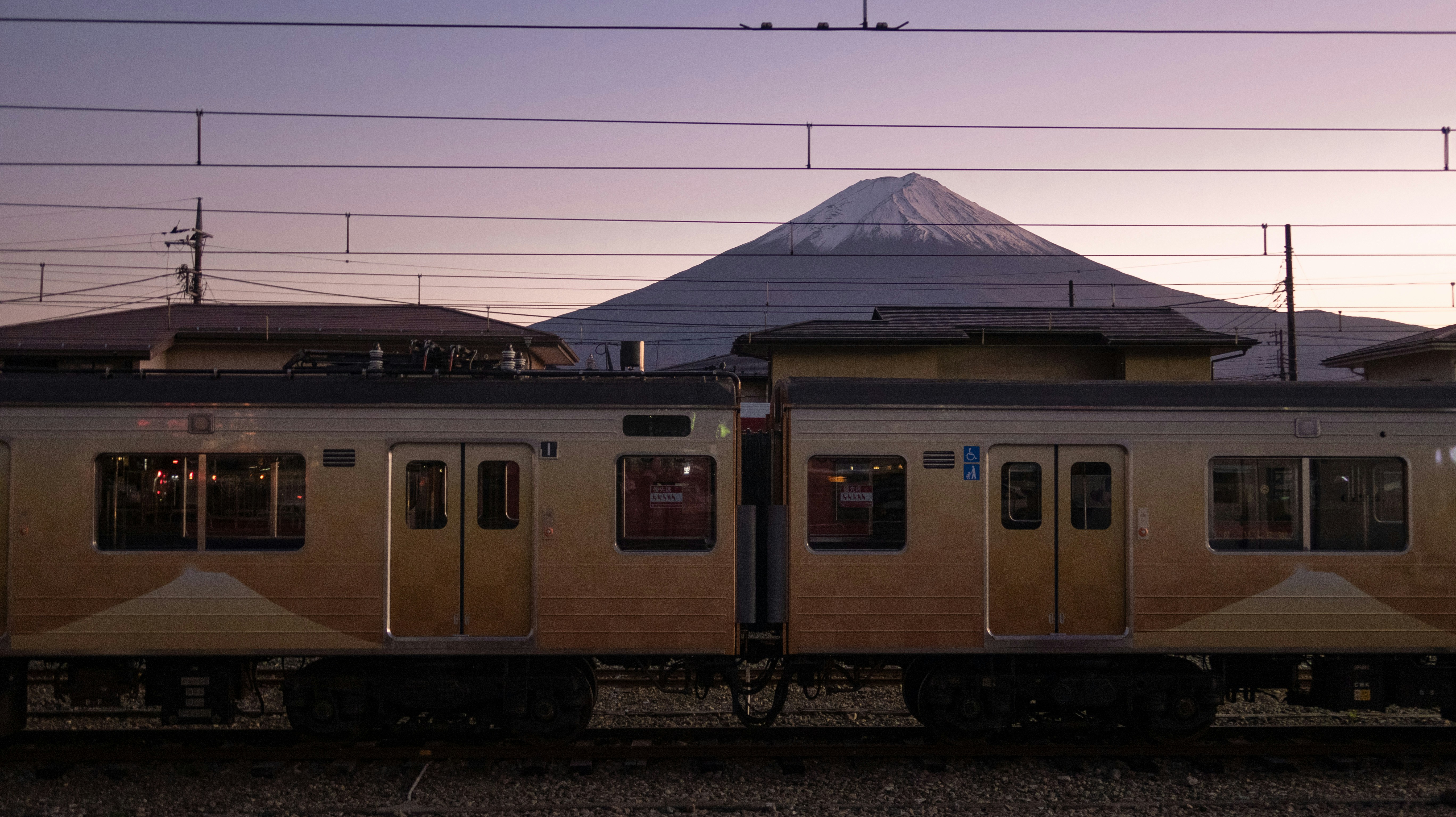 A limited express train waiting at a Tokyo platform early in the morning