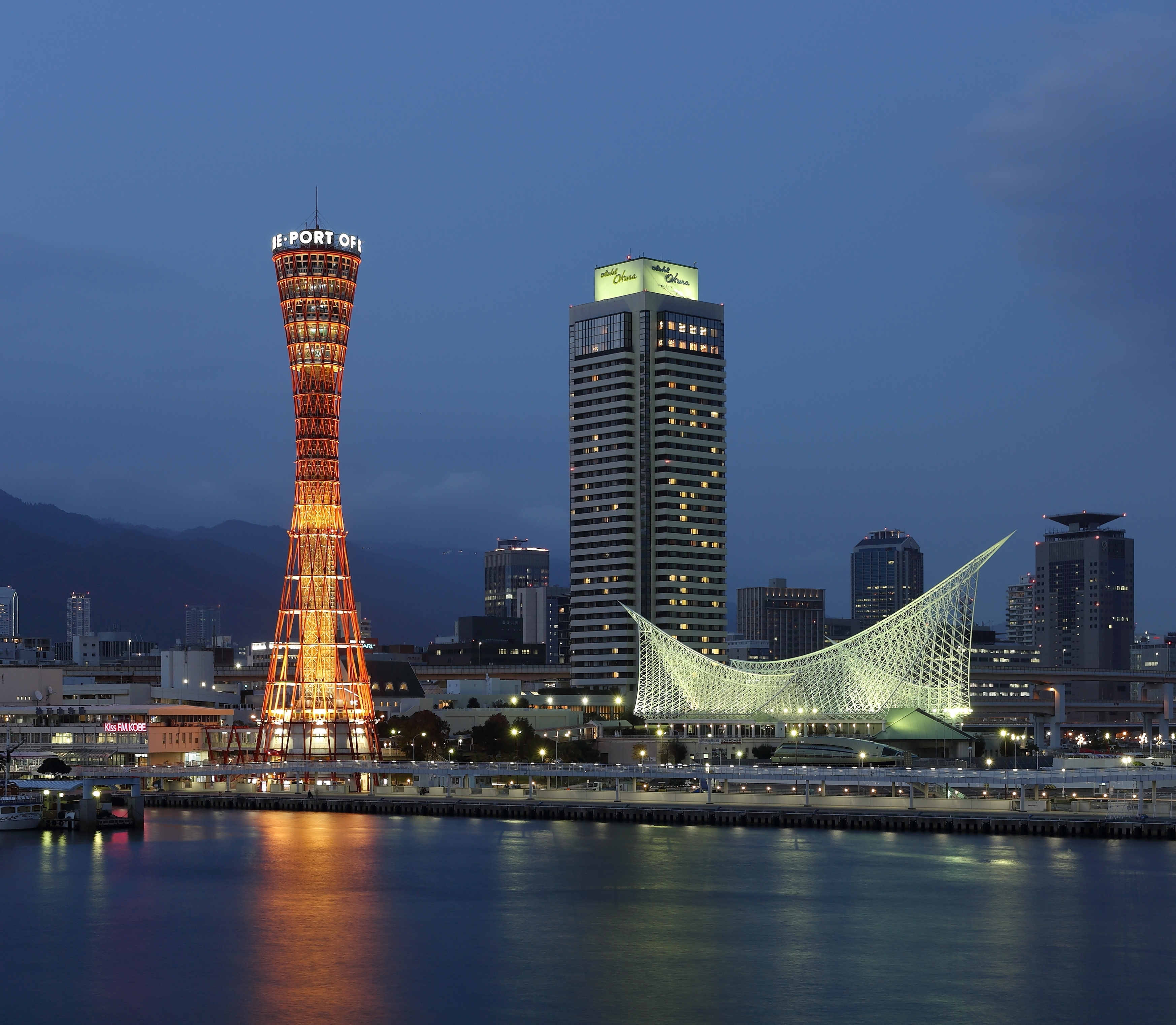 The waterfront harbour promenade in Kobe with the port skyline behind