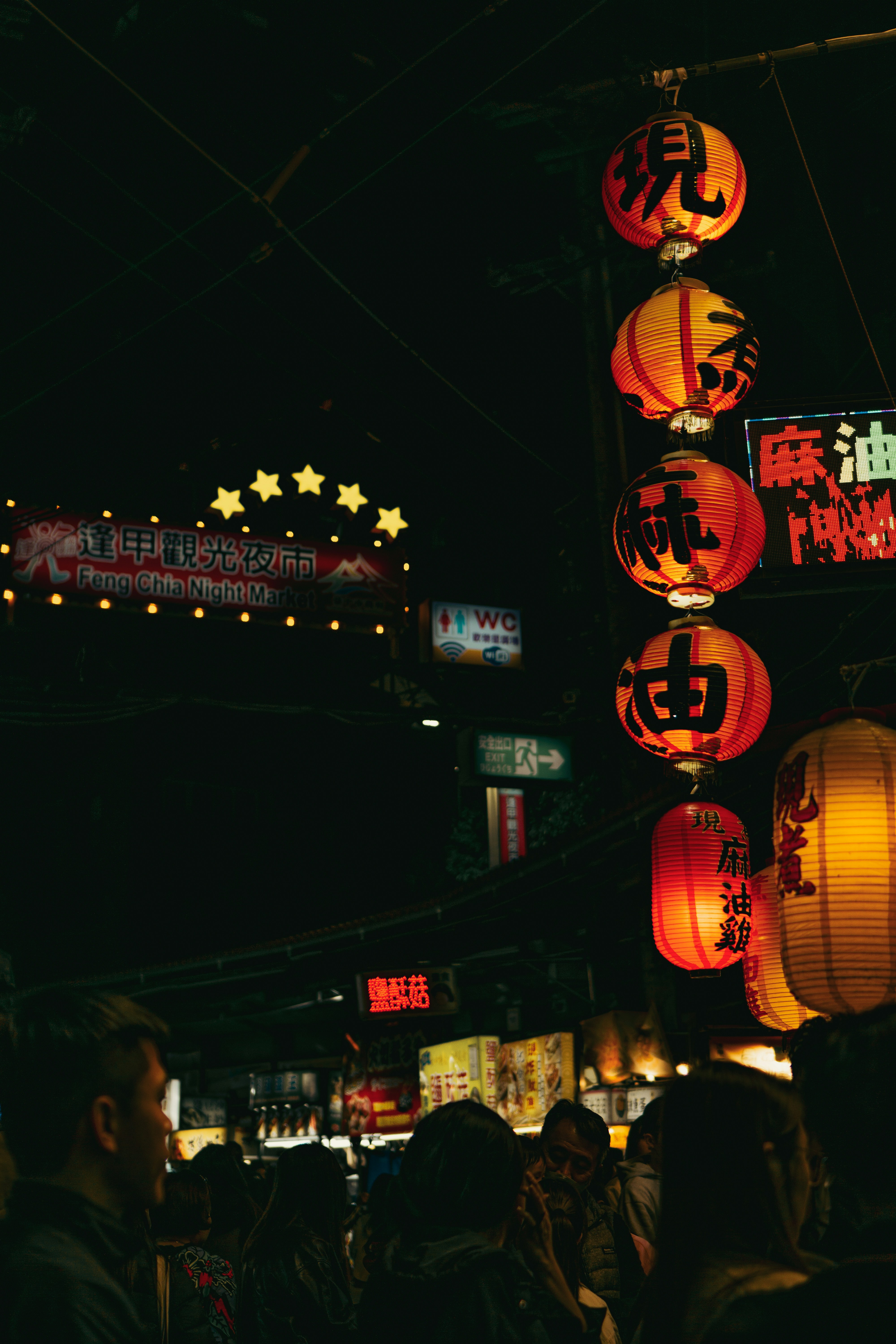 A festival float lit with paper lanterns on a yoiyama evening in Kyoto