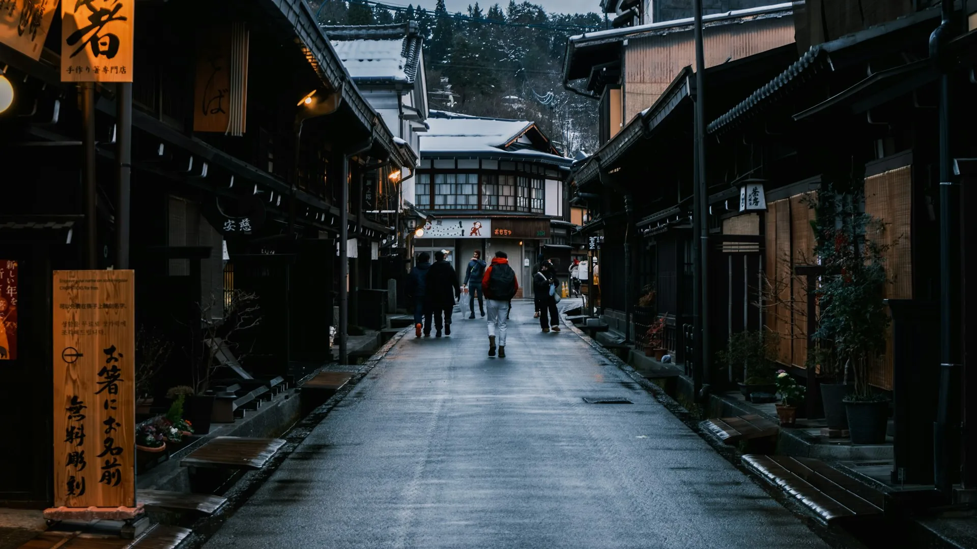 Sanmachi-suji wooden Edo-era merchant street in Takayama lit by morning light
