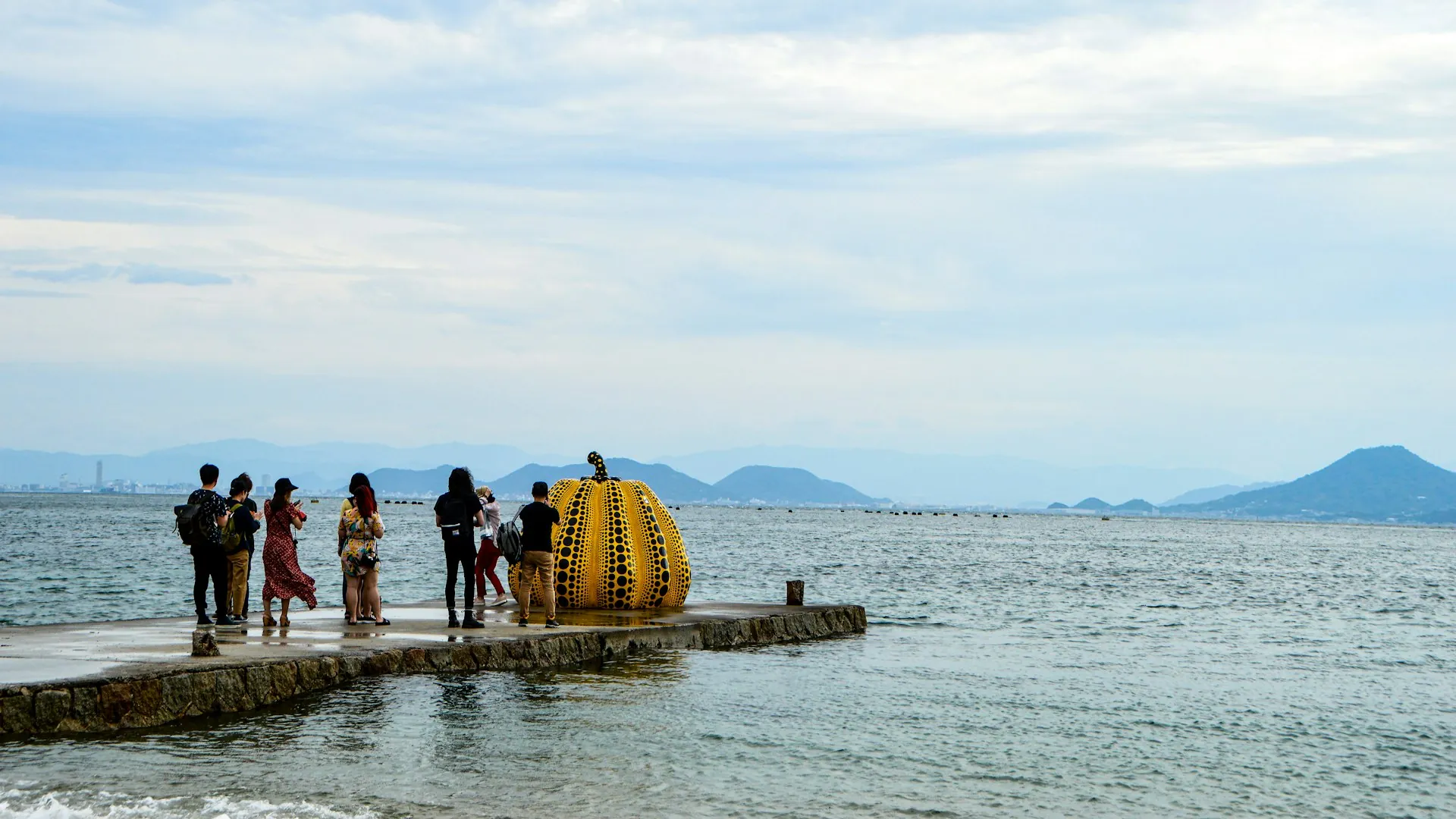 Naoshima art island with Inland Sea backdrop and pumpkin sculpture