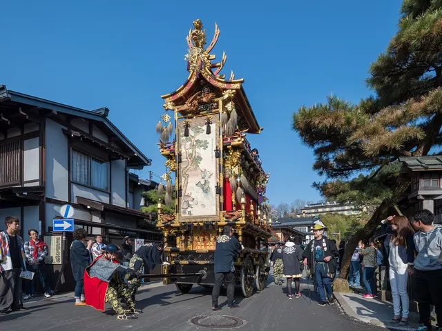 A decorated Takayama Matsuri float moving through the streets of Takayama