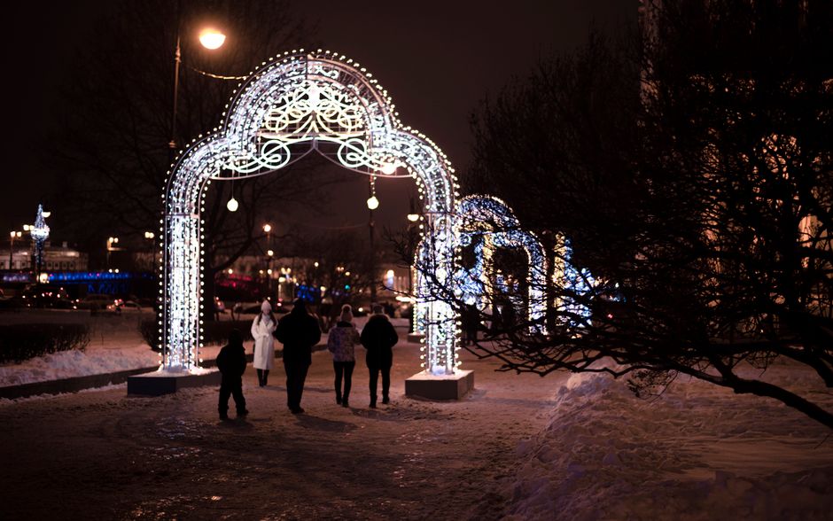 Winter illuminations glowing over a park path in Japan on a December evening