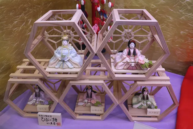 A display of hina dolls in wooden frames at a station in Tokyo