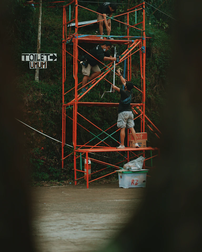 Visitors climbing through Athletic Forest's interactive installations